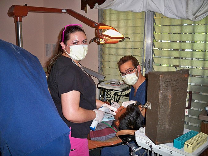 Dr. Baldwin and assistant examining patient