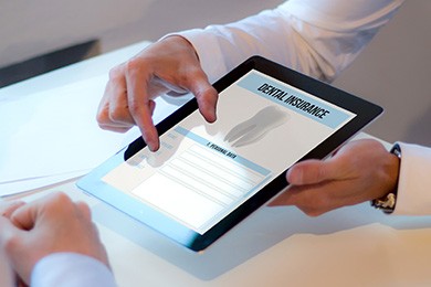 An insurance agent discussing dental insurance with a patient