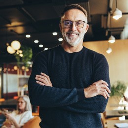 Man smiling with dental bridge in Arlington  