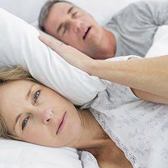 Wife bothered by husband snoring