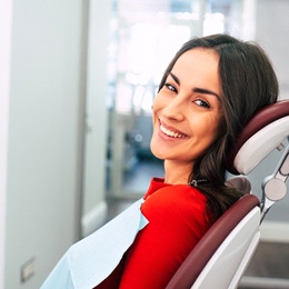 A young female waiting to see her dentist in Arlington for a regular dental checkup and teeth cleaning