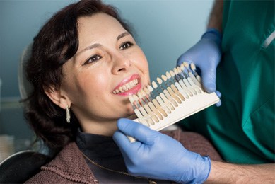 Woman seeking veneers in Arlington 