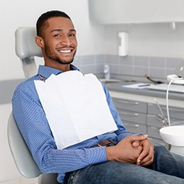 Man smiles after preliminary dental implant procedures in Arlington