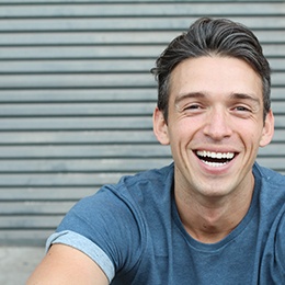 man smiling after getting Invisalign 