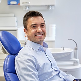  A smiling man sitting in a dentist’s chair