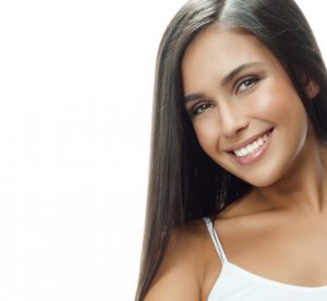 smiling woman after teeth whitening