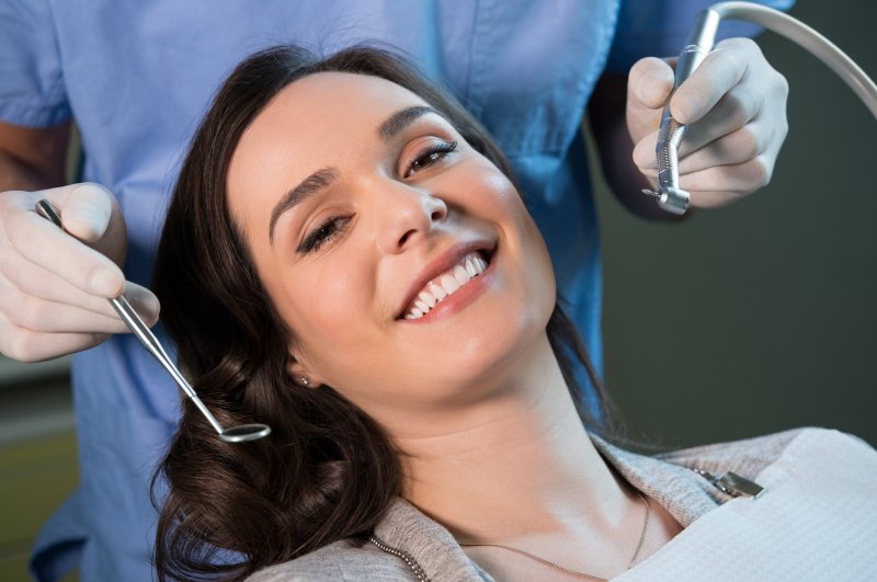 a woman undergoes a regular dental checkup and cleaning at the start of the new year
