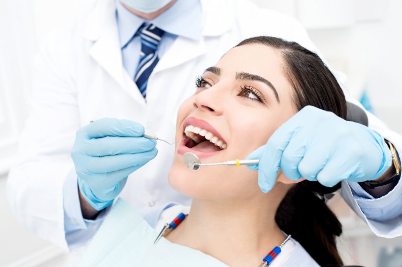 woman receiving a dental checkup in Arlington 