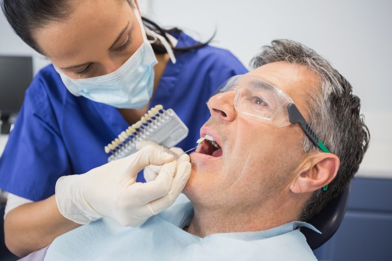 An older man being prepared for cosmetic dentistry